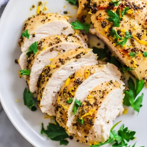 Freshly roasted lemon pepper chicken, a flavorful American main dish with zesty lemon flavor.