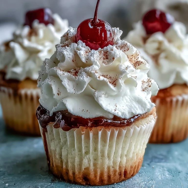 Mexican-inspired tres leches cupcakes with creamy topping, perfect for celebrating with friends and family.